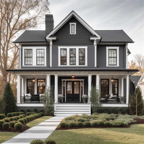 white metal roof on gray house|grey house with black awnings.